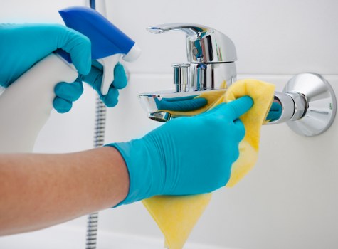 Cleaner reviewing safety measures before a carpet cleaning task